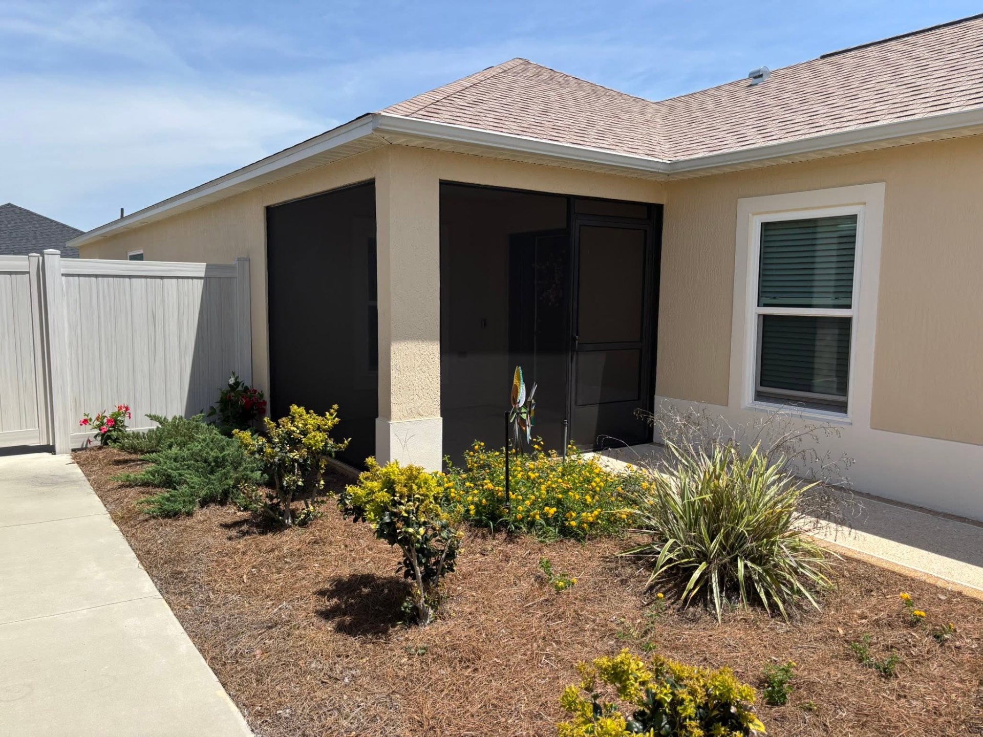 Mike's Custom Construction completed exterior project with modern patio screen enclosure